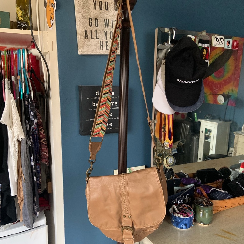 Pleather satchel with vibrant patterned strap.